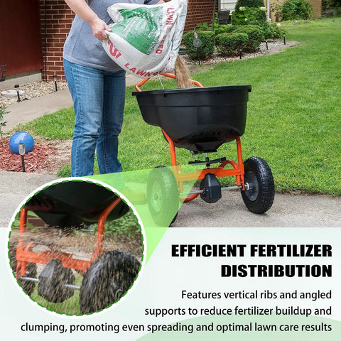 Person using heavy-duty fertilizer spreader with reinforced impeller, showcasing efficient distribution on lawn.