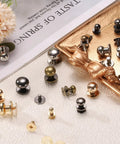 Badass Twenty Piece Round Head Button Stud Screws Seven Mm Brass Chicago Style Screws displayed on a tray with various colors and finishes.