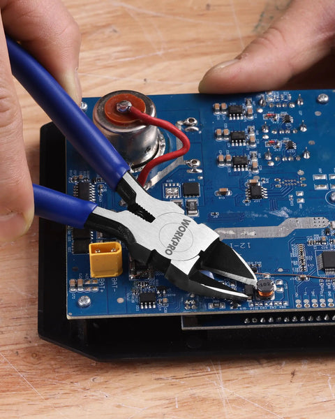 Using Six Piece Wire Cutters Set With Six Inch Precision Flush Cutters for precise wire cutting on a circuit board.