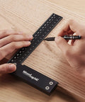 Person using Pro Grade Precision Square Ruler For Marking And Measuring In Carpentry - 4 Inch Aluminum Frame Tool on wood surface