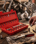 Knock Out Tough Shop Tasks With This Badass 3/8 Inch Drive 36 Piece Socket Ratchet Wrench Set Packing Smooth Chrome Steel Extensions and Universal Joints for Every Home Garage Project displayed with open toolbox.