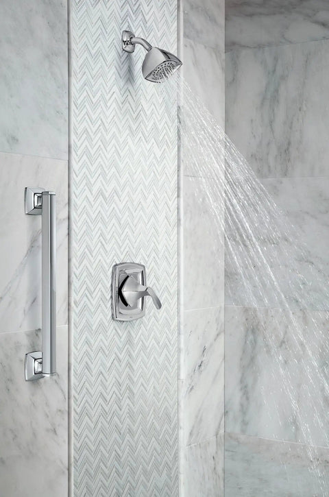 Heavy-Duty 24-Inch Chrome Finish Stainless Steel Bathroom Grab Bar For Safe Steady Access installed in a tiled shower.