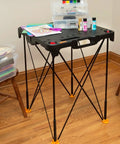 Sidekick Folding Work Table Portable All-In-One Work Bench For DIY Projects, Ultra Lightweight 13 Lb set up with tools in a room