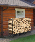 4 Foot Firewood Rack With Weatherproof Cover, Outdoor Log Storage And Indoor Firewood Stand, next to cabin wall.