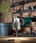 Game Changer 1 2 Inch Drill Chuck Adapter With Quick Swap Hex Drive attached to impact wrench drilling into wood.