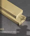 Top Shelf Pure Brass Finger Pulls With Brushed Matte Finish Hella Slim Modern Cabinet Handles Five Inch Center To Center Six Pack resting on dark surface.