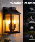 Solar Outdoor Wall Lights For Porch And Patio Two Pack Triple Panel Design, weather-resistant lantern illuminated in rain.