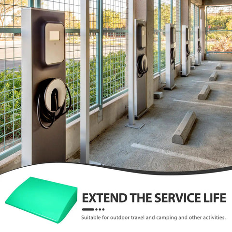 Heavy Duty Green Abs Weather Resistant Ev Charger Station Protection Box With Rock Solid Sun Shield And No Sweat Rain Guard For Outdoor Parking Lot Use in a parking lot.