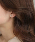 Dainty Titanium Surgical Steel Cz Stud Earrings Multipack in 3mm size worn by a woman, perfect for sensitive ears.