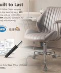 Mid Century Modern Office Chair Grey Faux Suede Ergonomic Mid Back Executive Seat With Lumbar Support Swivel Base With Smooth Rolling Casters Built Heavy Duty For Legit Comfort And A Top Tier Home Office Desk Setup, showing a stylish chair with plush padding.