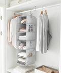 Hella Versatile Hanging Closet Organizers, 10 Pack Convertible Storage Shelves, Gray hanging with folded clothes and towels.
