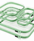 Clear Hard Shell Zipper Case And Mini Pouch Set To Keep Your Daily Stash Organized With Tough Rigid Construction And Slick Stackable Design For Hassle Free Travel Packing And Easy Access Without Ever Messing Up Bags - stack of four green zipper cases, various sizes, transparent material.
