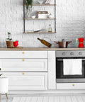 Kitchen scene featuring Thirty Pack Gold Cabinet Pulls Single Hole Built Tough Zinc Alloy Kitchen Drawer Handles Smooth As Silk Feel.