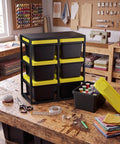 6 Piece Stackable Mini Storage Bins With Bright Yellow Lids And Sturdy Black Rack Compact Plastic Containers on wooden table with sewing supplies.
