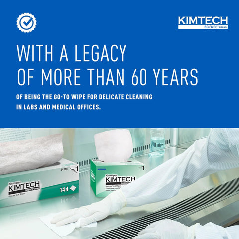 Kimtech Kimwipes delicate task wipers, white 1-ply, unscented, 4.4 x 8.4 in, two boxes on a lab bench with gloved hand.