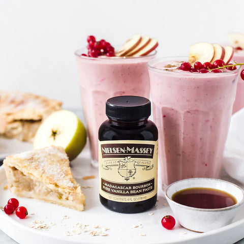 Madagascar Bourbon Pure Vanilla Bean Paste For Baking And Cooking, bottle with fruit smoothies and pie, 1 gallon.