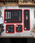 Magnetic Tool Mat 4 Pack Flexible Holds Tools Tight With 40Lb Magnetic Power Keeps Screwdrivers, Wrenches, Bolts Secure On Tilt Or Vibration, Ultimate Workbench Organizer For Garage And Shop, four black red mats on metal bench