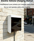 All Season Charger Protective Cover Built Tough To Handle Whatever Weather Dishes Out While Keeping Your Electric Vehicle Charging Station Secure And Dry For Worry Free Outdoor Wall Installations mounted on a brick wall, showcasing its weatherproof design.
