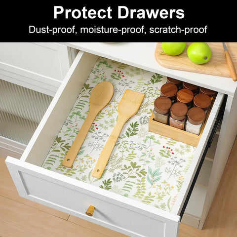 Dead Simple Waterproof Shelf And Drawer Liners For Kitchen Cabinets And Pantry Non Adhesive Oil Resistant Easy Rinse Anti Slip Cabinet Mats with wooden utensils in a drawer.