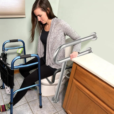 Real Deal Brushed Nickel Toilet Support Rail With Rock Solid Non Slip Grip For Seniors And Bath Safety 24 Inch wall mounted beside toilet.