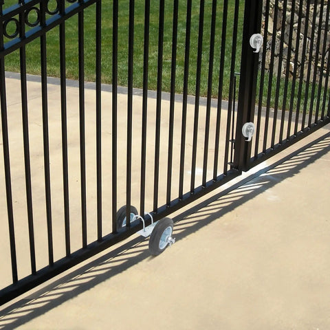 Built Like A Tank Sliding Door Roller Set featuring galvanized steel wheels on black gate, designed for smooth operation.