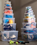 Sixty Quart Clear Stackable Storage Bins With Tight Lids Hella Huge Plastic Totes For Kitchen Pantry Organization Bpa Free Food Safe Container Pack Of Four stacked with sports gear and helmets.