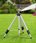 Heavy Duty Brass Impact Tripod Sprinkler With Pulsating Water And Telescoping Legs Delivers 360 Degree Coverage Up To 70 Feet Reaching 5660 Square Feet Perfect For Yard Lawn Garden Irrigation 16 26 Or 36 Inch Heights on grass