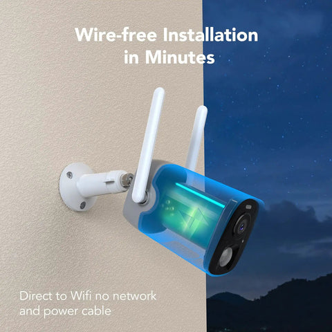 Wireless Outdoor Security Camera With 2K Color Night Vision And AI Motion Detection mounted on a wall at night