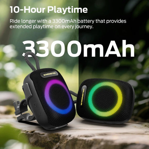 Outdoor Bluetooth Speaker with IPX7 Waterproof Rugged Build, Compact Yet Loud, 10 Hour Playtime, RGB Lights, on mossy rock.
