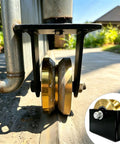 4 Inch Sliding Door Rollers V Groove Wheels With Welded Brackets Double Bearing 3000 Lb Capacity close-up on track.