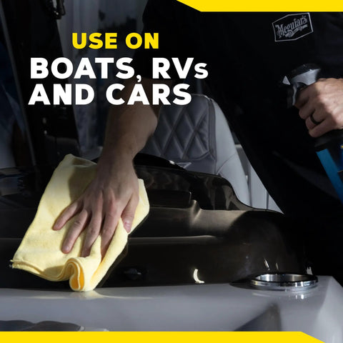 Person applying Hybrid Ceramic All Surface Sealant For Marine And RV Use, Easy Spray Spread Wipe On UV Protection For Fiberglass And Gel Coat, Boosts Gloss Beading And Durability, Weatherproof Shine In A 32 Oz Bottle on a boat surface