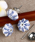 Snag These Six Piece Vintage Shabby Ceramic Cabinet Knobs With Hand Painted White And Blue Floral Drawer Pulls For Cupboard And Dresser Hardware To Level Up Your Home Decor Game Today, featuring round ceramic knobs with floral designs.