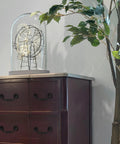Slick And Dang Durable Drop Bail Cabinet Pulls With Oil Rubbed Bronze Finish on purple cabinet with decorative element.