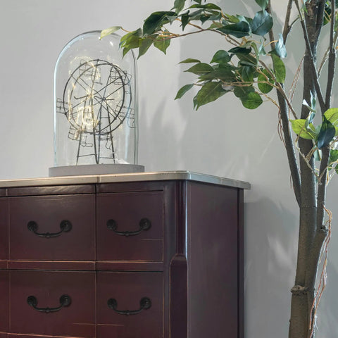 Slick And Dang Durable Drop Bail Cabinet Pulls With Oil Rubbed Bronze Finish on purple cabinet with decorative element.