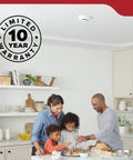 Hardwired Smoke Detector With Aa Battery Backup And 120V Ac Power Two Pack delivering quick smoke alerts above a family in a kitchen.