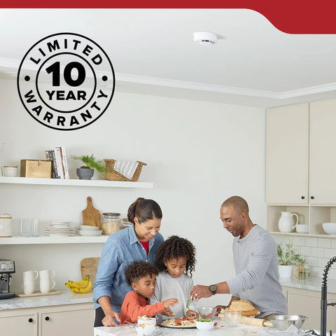 Hardwired Smoke Detector With Aa Battery Backup And 120V Ac Power Two Pack delivering quick smoke alerts above a family in a kitchen.