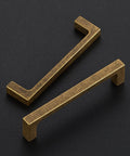 Built Tough Vintage Style Antiqued Brass Cabinet Handles Featuring Dead Nuts Solid Square Bar Pulls For Heavy Duty Kitchen Drawers And Cabinet Doors Four Inch Spacing Five Pack Set, showcasing two antique brass pulls.