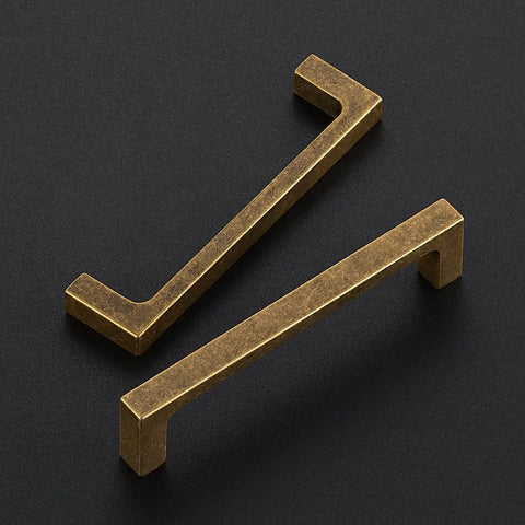 Built Tough Vintage Style Antiqued Brass Cabinet Handles Featuring Dead Nuts Solid Square Bar Pulls For Heavy Duty Kitchen Drawers And Cabinet Doors Four Inch Spacing Five Pack Set, showcasing two antique brass pulls.
