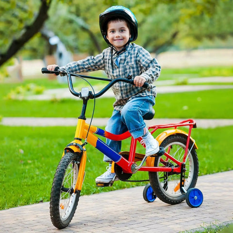 Child riding a colorful bike with training wheels in a park, showcasing Two Pack Heavy Duty Bike Inner Tubes 20x1.50 1.75 1.90