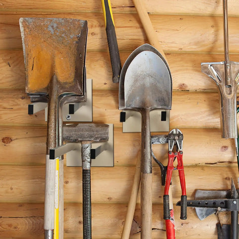 Real Deal Steel Shovel Holder Wall Mount 2 Pack With Extended Tines holding shovels and tools on a wooden wall.