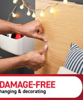 Attaching Damage Free Indoor Mini Light Clips Value Pack With 45 Clips And 54 Strips to wood surface for decor