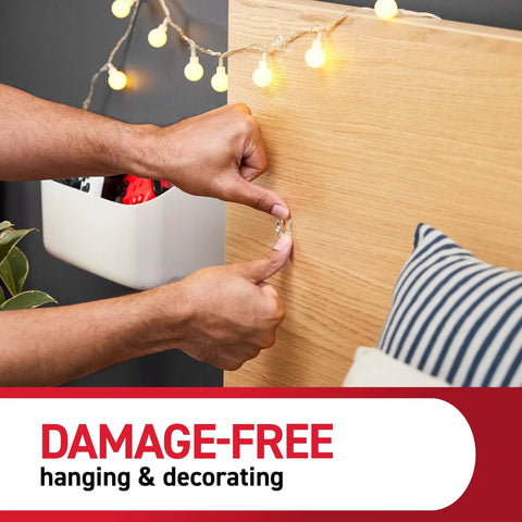 Attaching Damage Free Indoor Mini Light Clips Value Pack With 45 Clips And 54 Strips to wood surface for decor