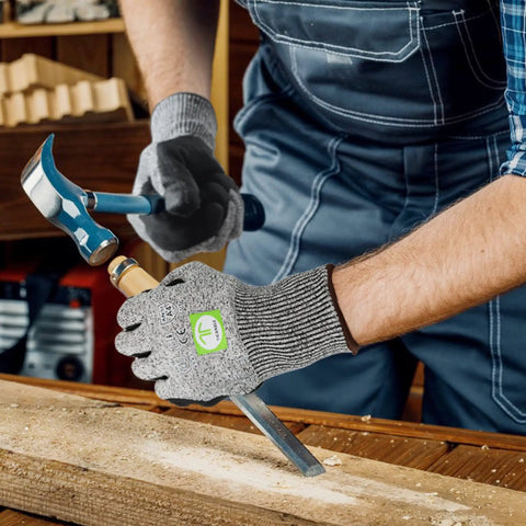 Three Pair Level Five Cut Resistant Gloves With Nitrile Coated Grip protecting hands using tools on wood in workshop