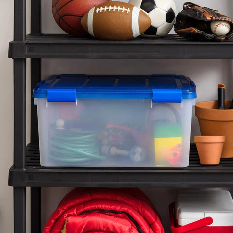 60-Quart Clear Airtight Storage Totes with Secure Latching Lid Stackable Plastic Containers for Garage Basement Closet That Are Built Different and Handle the Heat like Pros on a shelf with sports equipment.