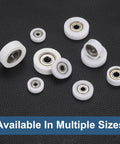 5 Pack Dead Silent Nylon Track Rollers With Rock Solid Precision Bearings 10mm Bore 38mm Outer Ring 12mm Thickness scattered on a textured black surface.