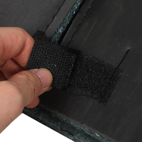 Hand holding a self-adhesive soundproof foam strip for air conditioner compressor noise reduction and vibration dampening using quick stick panels.
