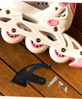 Replacement Inline Skate Brake Kit Universal Toe Stopper with screws on wooden floor next to white and pink inline skate