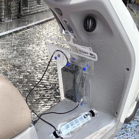 Top Shelf Waterproof Charging Cover For Electric Scooters And Ebikes clear rainproof guard shown over charging port with wet surface.