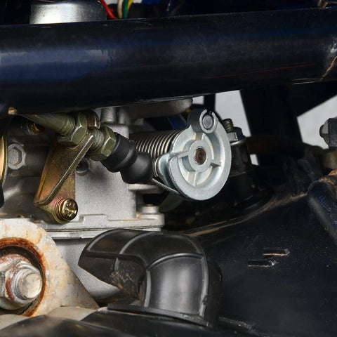 Close-up of ATV Thumb Throttle And Brake Cable Kit With Full Metal Speed Governor, mounted on engine, showing cable connections.