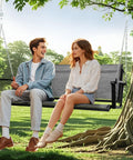 Couple sitting on Textilene Three Seat Hanging Swing For Backyard Chill Sessions With 5.2 Ft Patio Bench Heavy Duty Outdoor Porch Swing